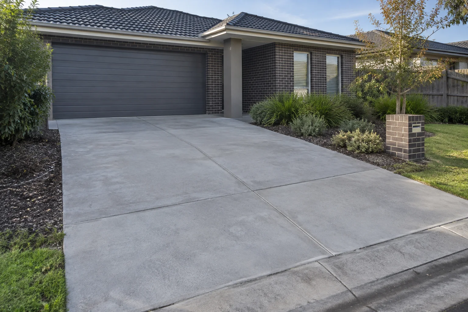 Finished plain concrete driveways in a Geelong-style residential setting